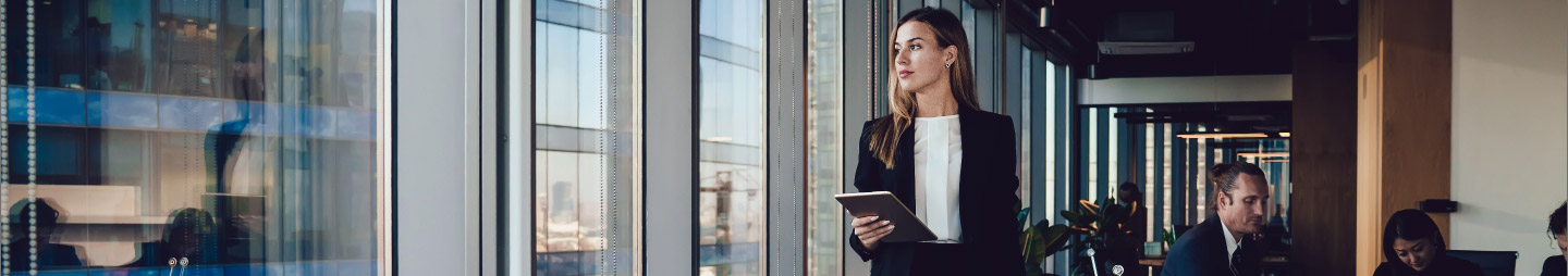 girl in office looking outside her window